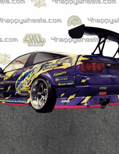Rear left view of a 1:10 scale model drift car with Takashi Takenaka graphics