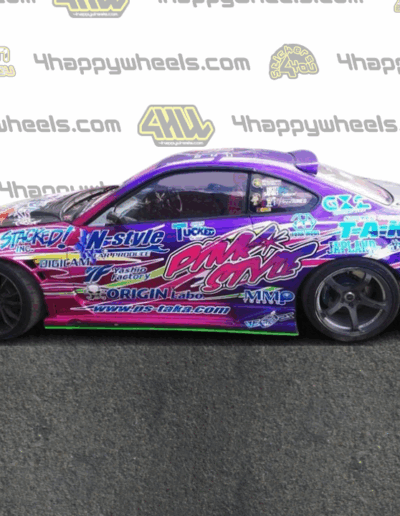 Left side view of a 1:10 scale model of a drift car featuring Pink Style graphics