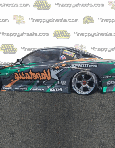 Left side view of a 1/10 scale model drift car with Vapetasia graphics