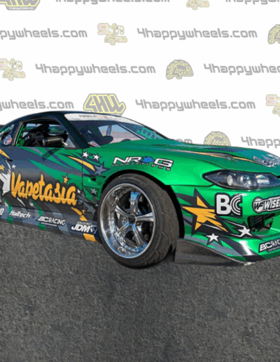 Right side view of a 1/10 scale model drift car with Vapetasia graphics